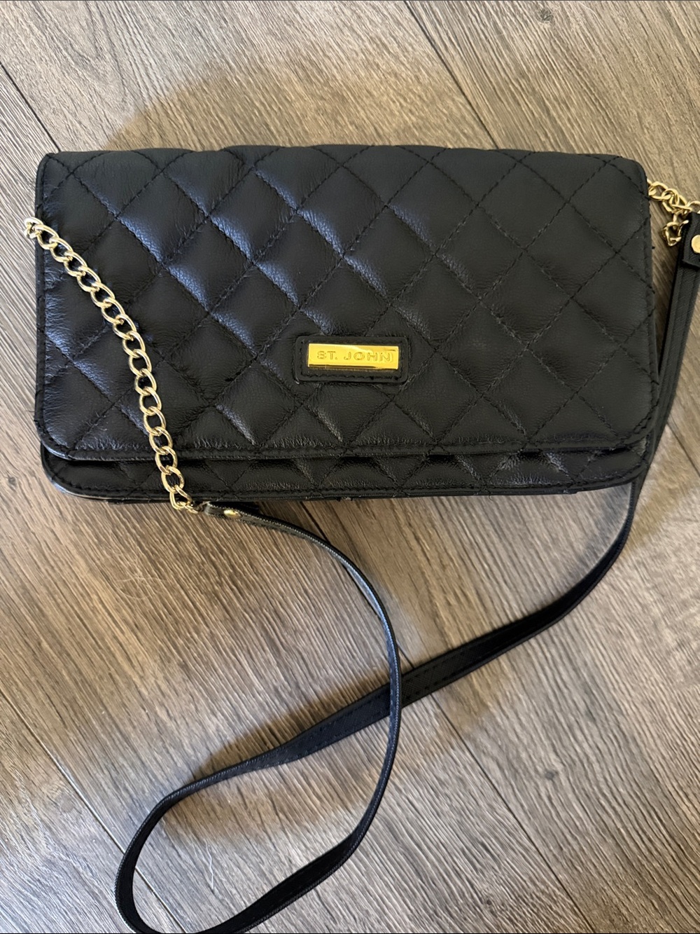 St. John classic black quilted leather crossbody bag.